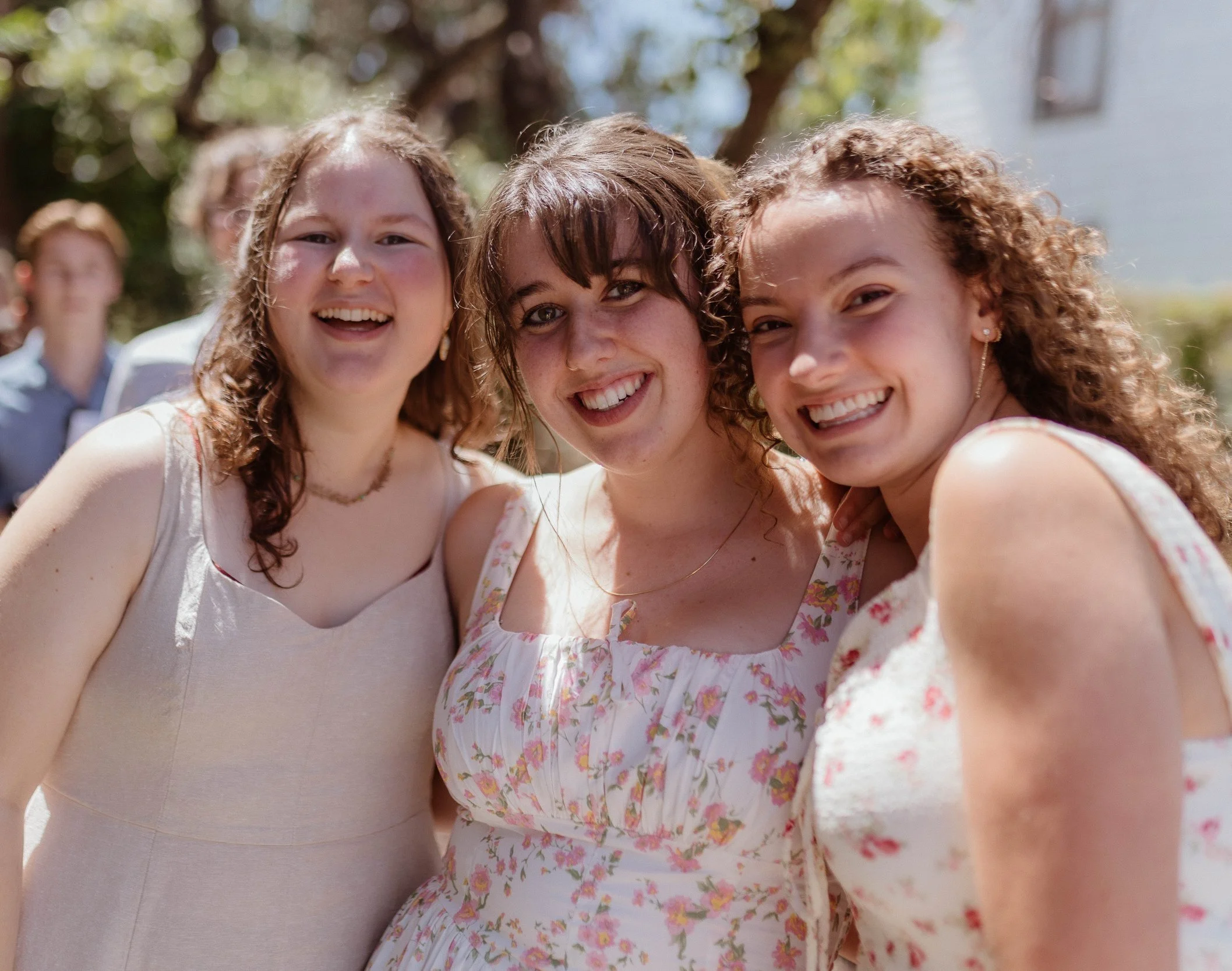 Three students from a Christian college standing outside.