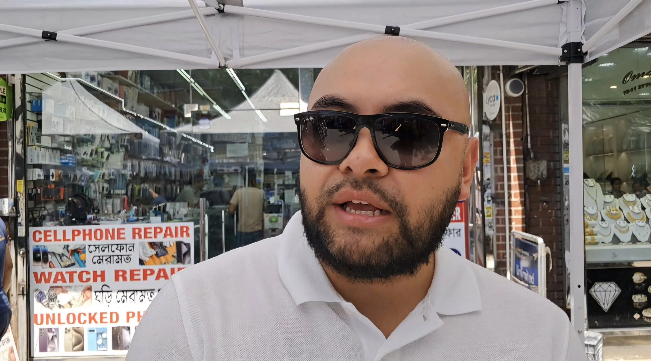 Queens residents bustle as usual, but now gripped by fear too