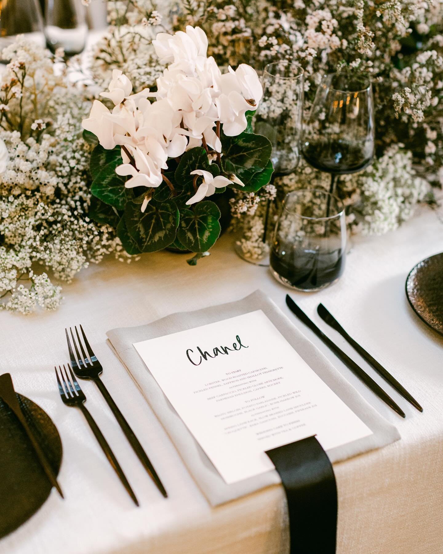 Ribbon details 🎀 

Before bows were in, ribbons were the hero of this gorgeous wedding, with each menu featuring a ribbon detail cascading over the edge of the table, in a nod to the statement ribbon seating chart. 

Such a small detail, with such a