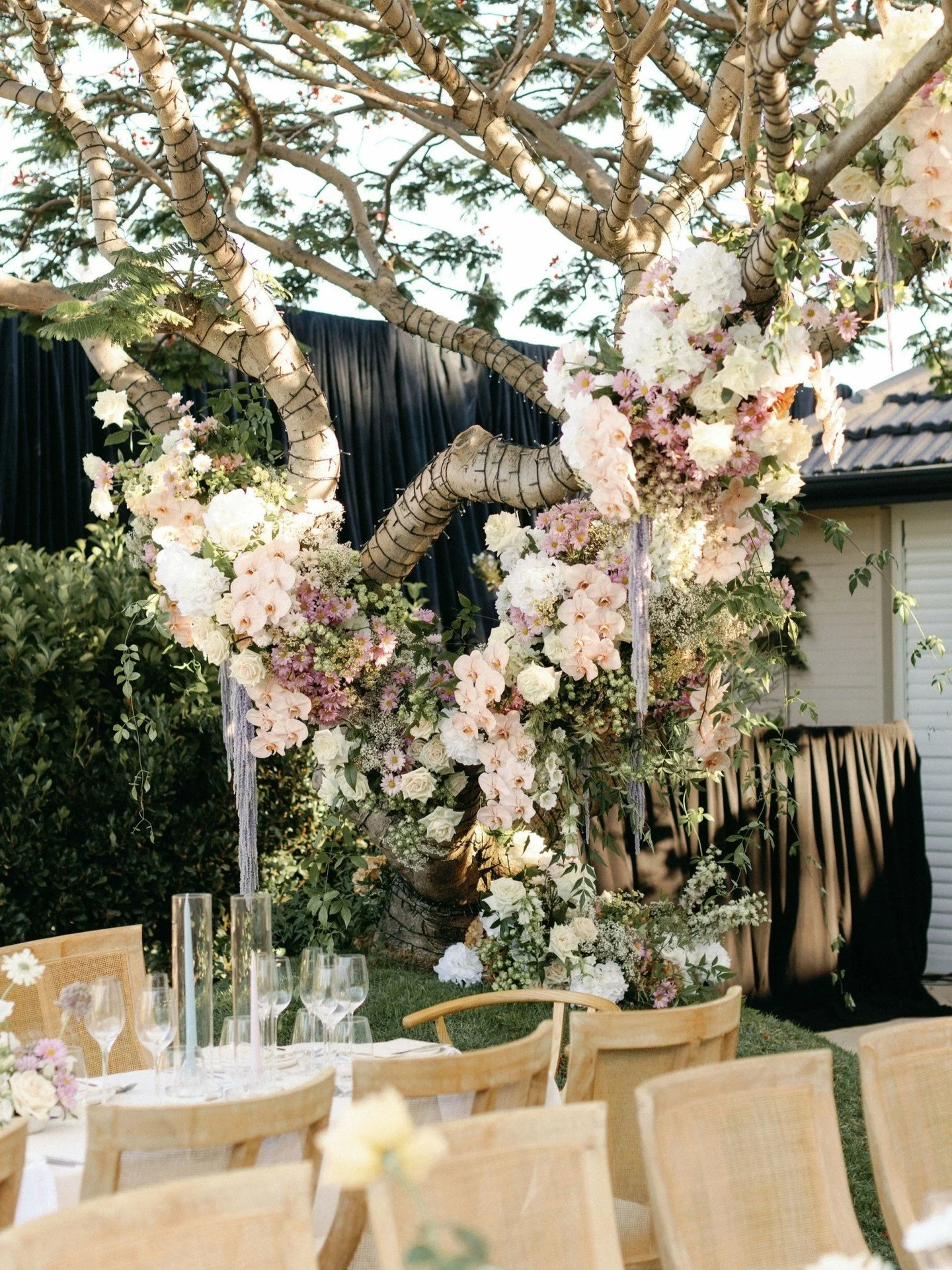 Designing to the Space 🌿

Every location offers its own natural features to work with. Being a private property open air wedding we had limitations to what could be hung, instead we transformed an existing tree into a striking floral feature to crea