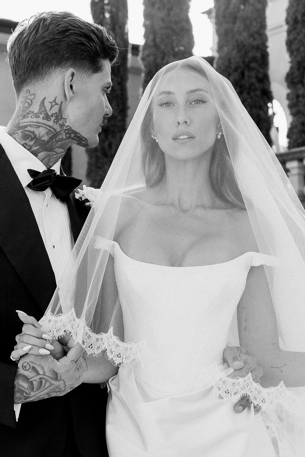 Moody editorial-style wedding portrait of couple