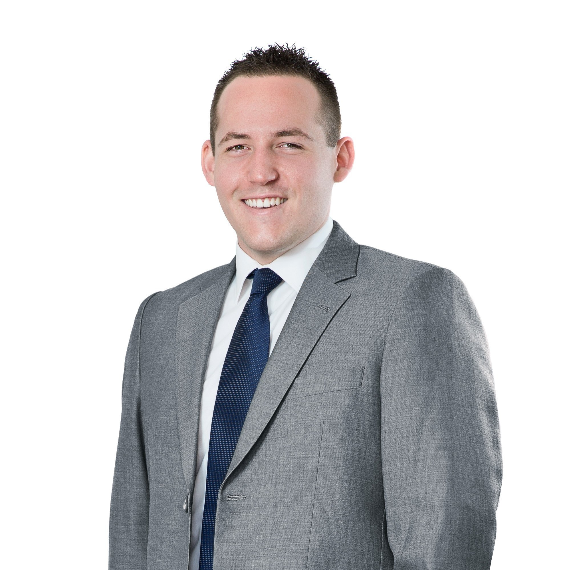 Daniel Innes is smiling for a corporate photograph, he looks very professional, he is wearing a grey suit with a white shirt and a navy tie, he is the Director and Mortgage Broker at My Finance Consultants.