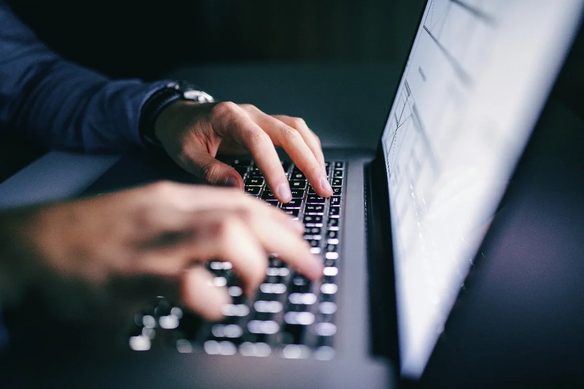 Typing on a computer to spot a phishing scam before it is too late