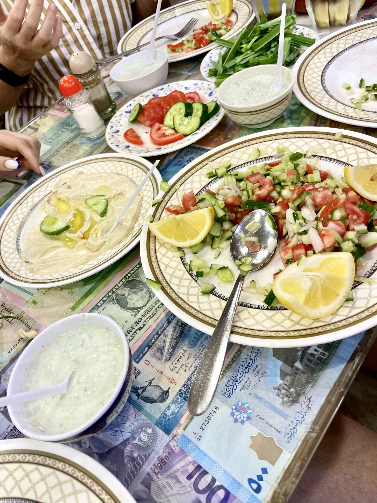 Table view of Hammus and Shirazi Salad