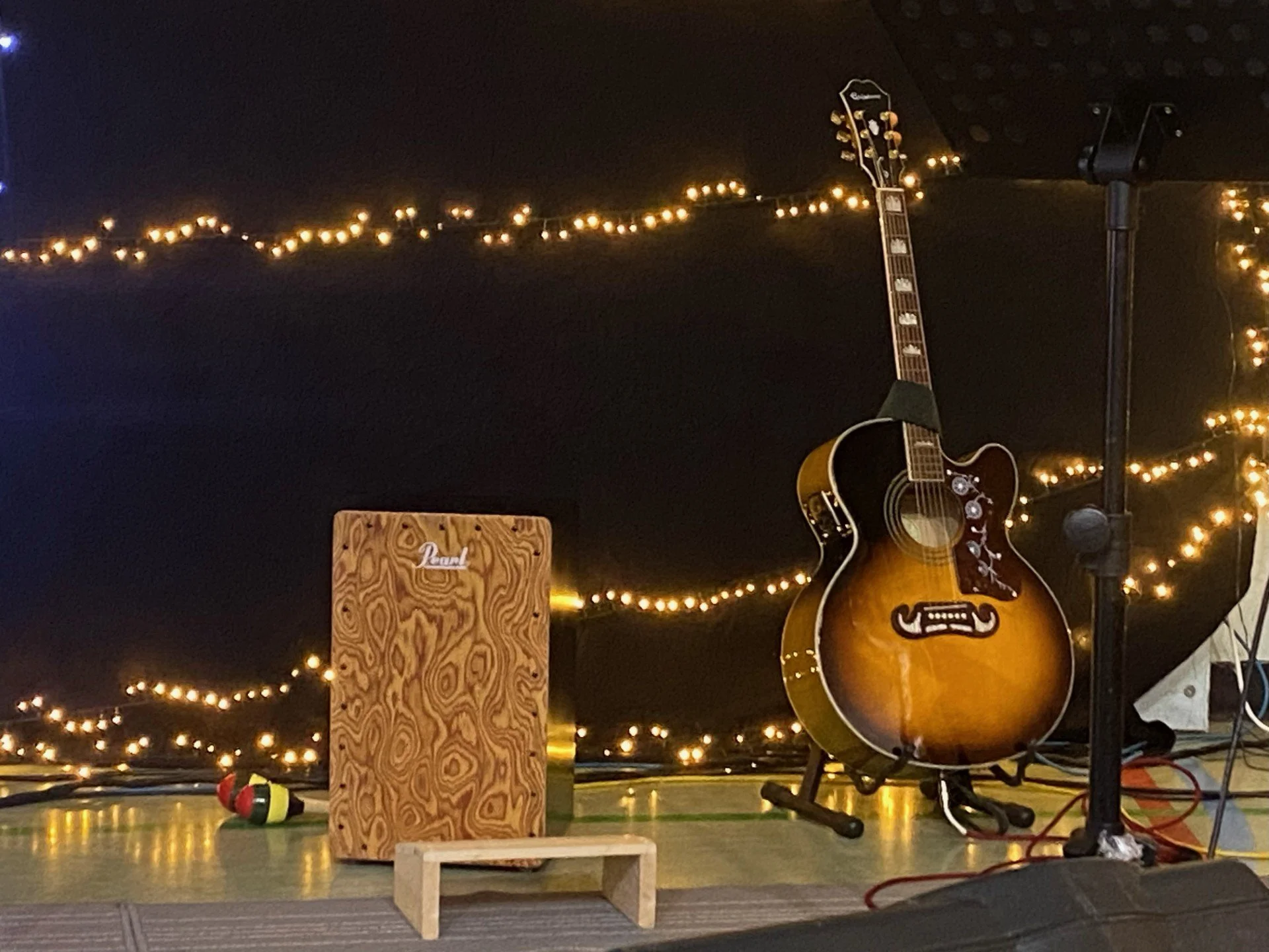 Christmas lights surround guitar and drum box
