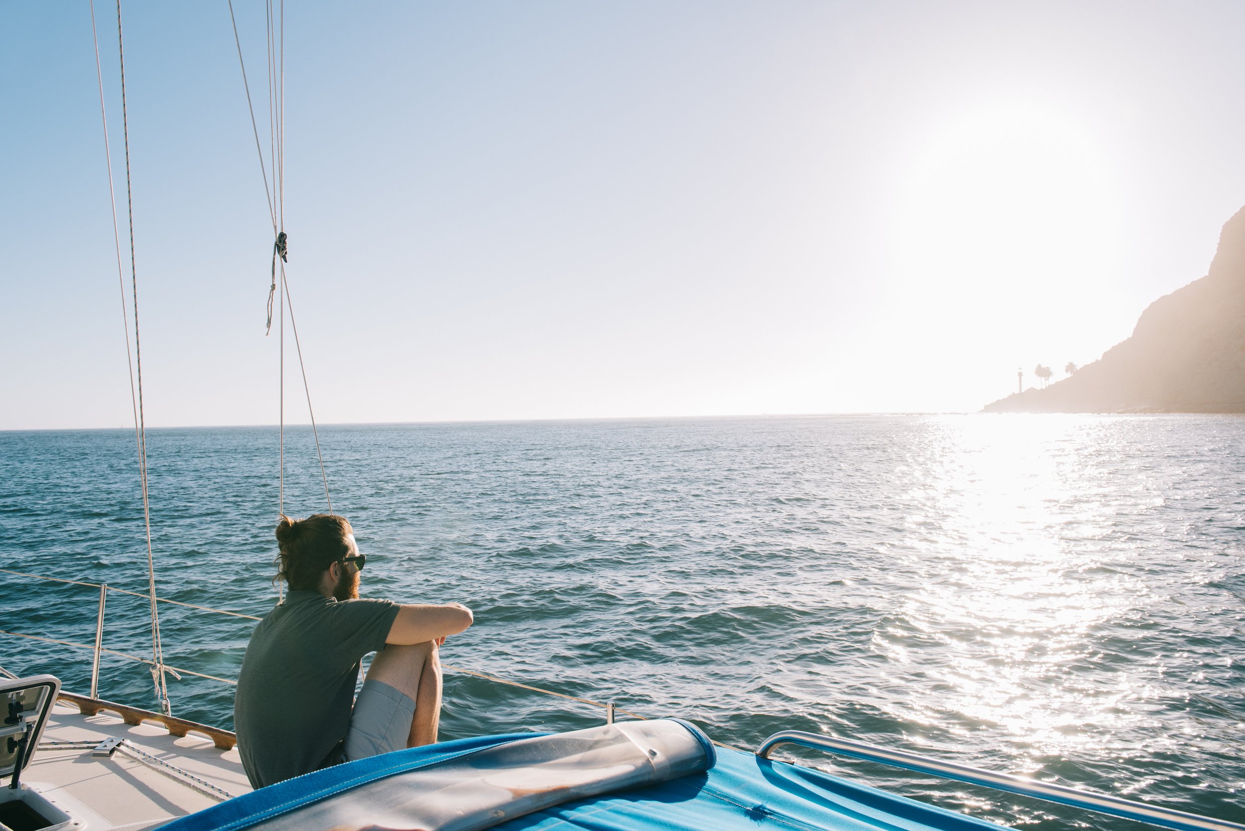 man-enjoying-sunset-on-sailboat-san-diego-bay-ca-2022-03-07-23-56-17-utc.jpg