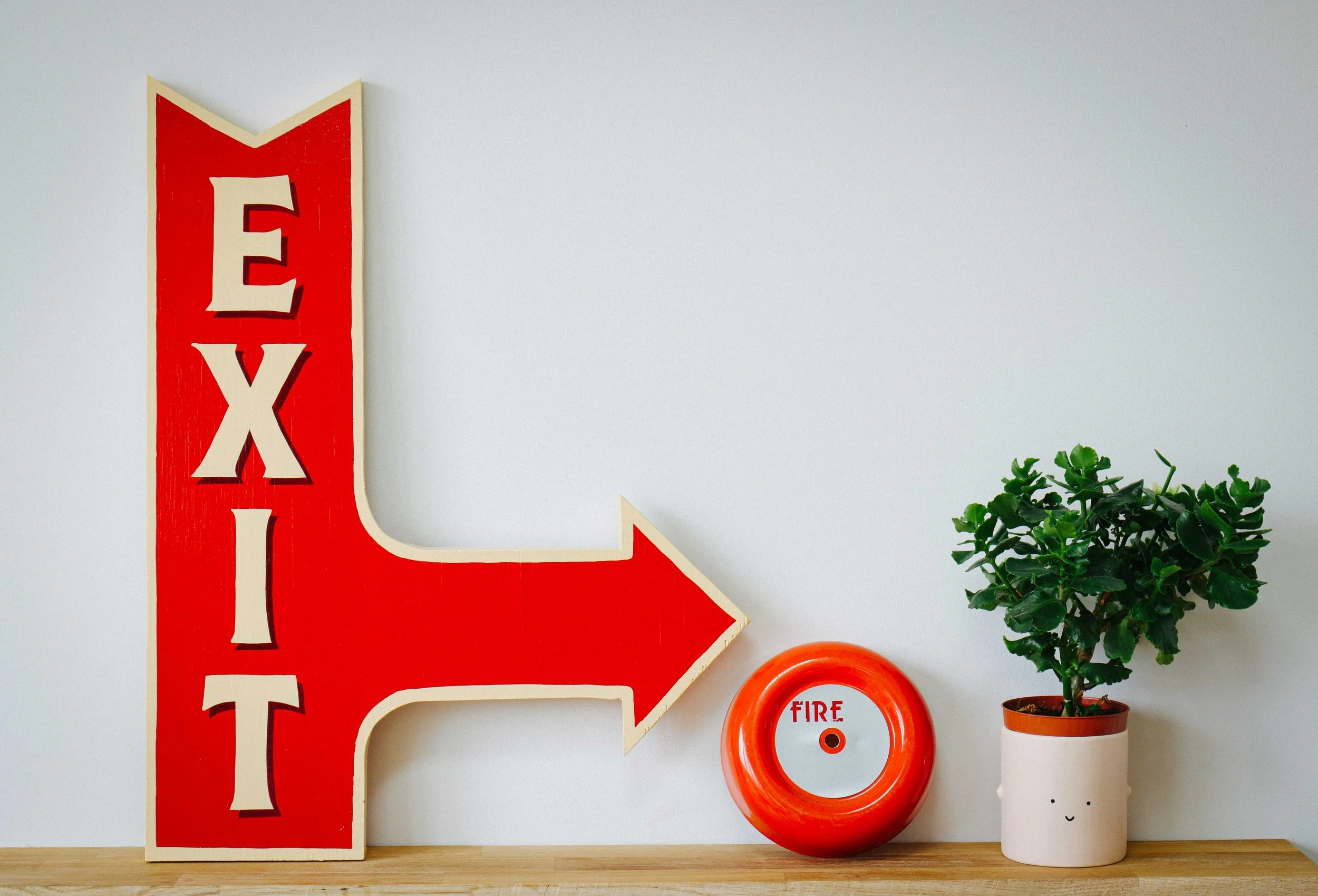 A hand-painted sign featuring bold, custom lettering in vibrant colours, showcasing the craftsmanship of Rich C Studio.