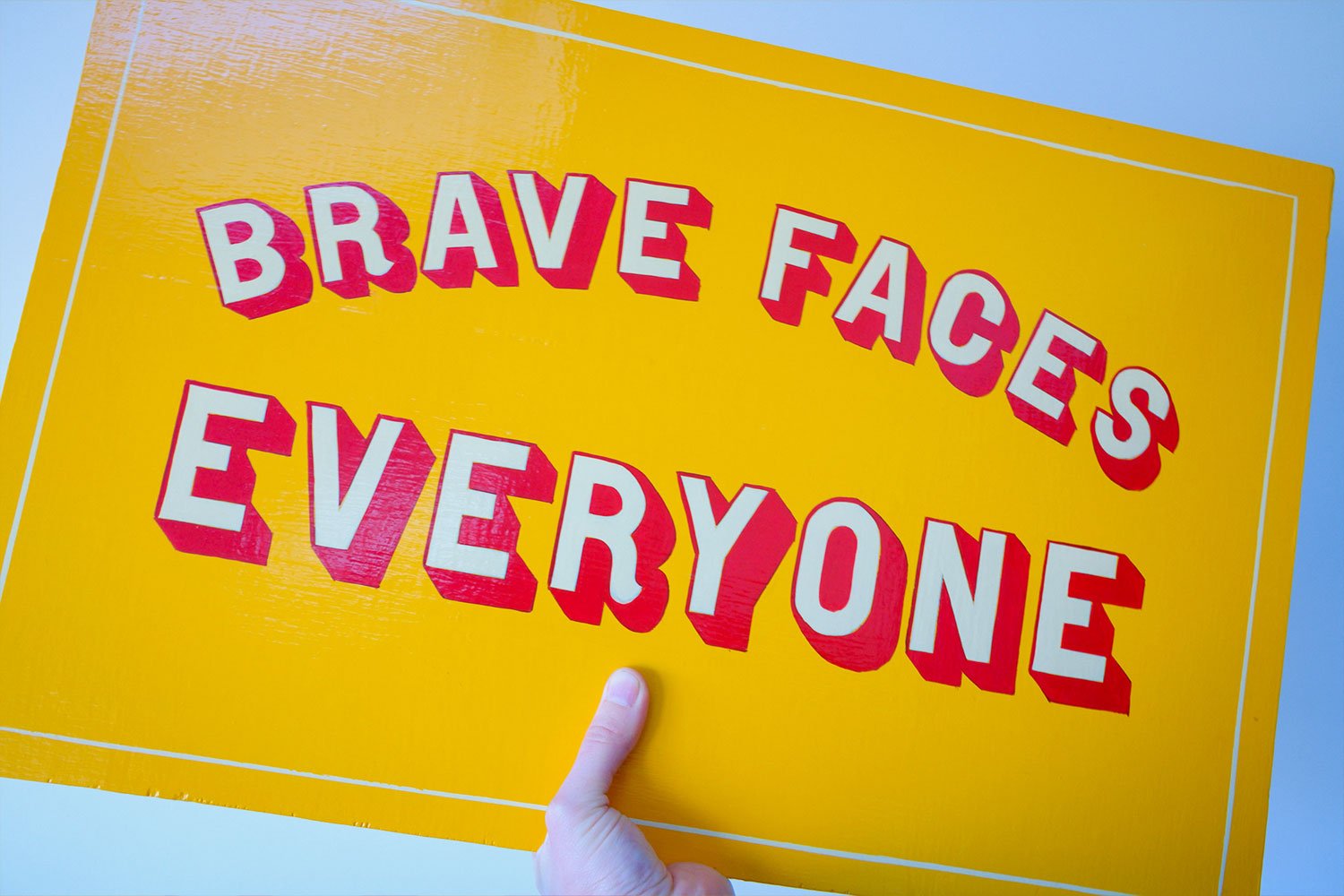 A striking hand-painted sign blending bold colours with detailed craftsmanship.