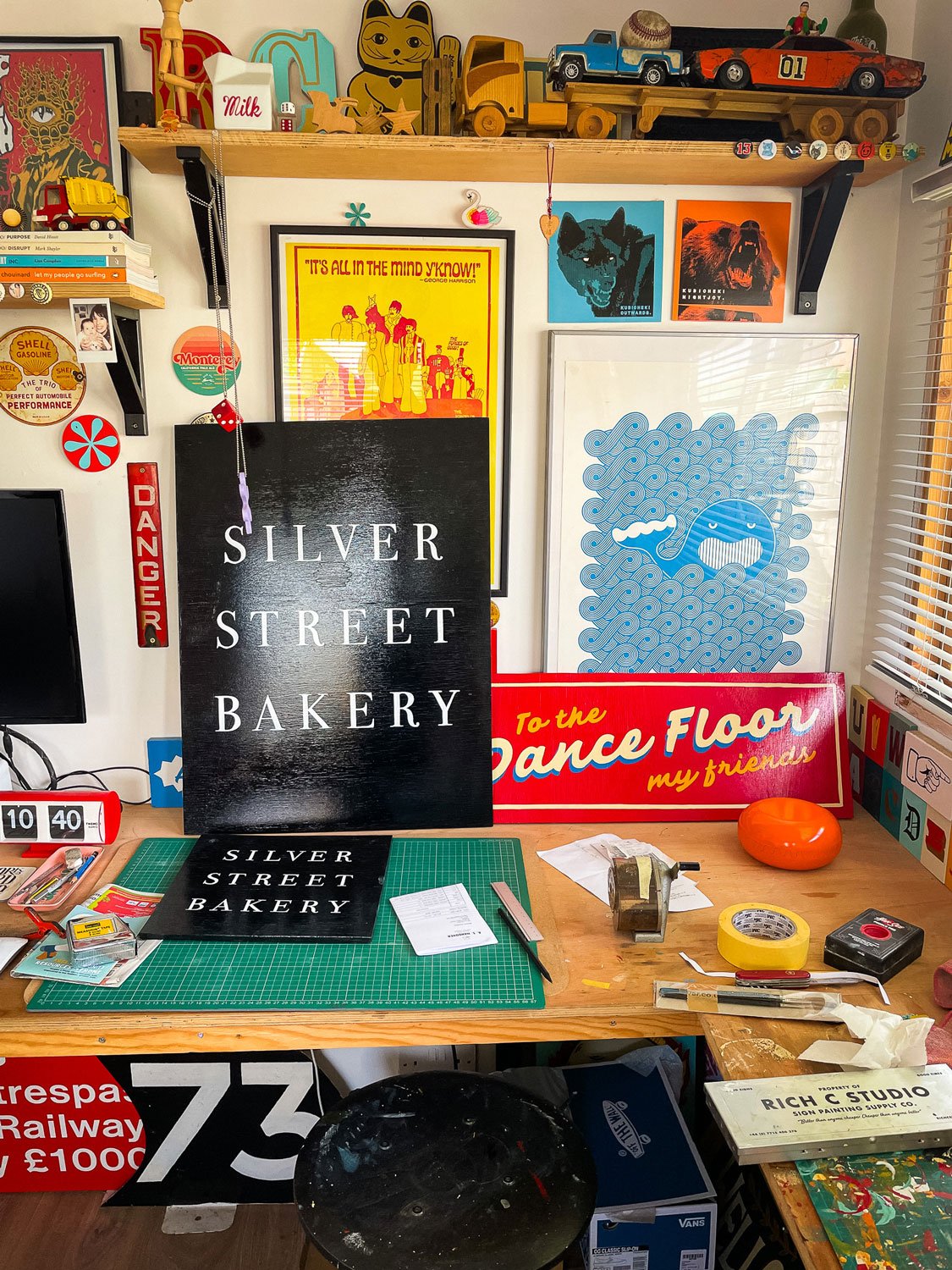 Hand-painted A-Board and hanging sign for Silver Street Bakery, featuring serif lettering on custom-made boards, showcasing the craftsmanship of Rich C Studio.