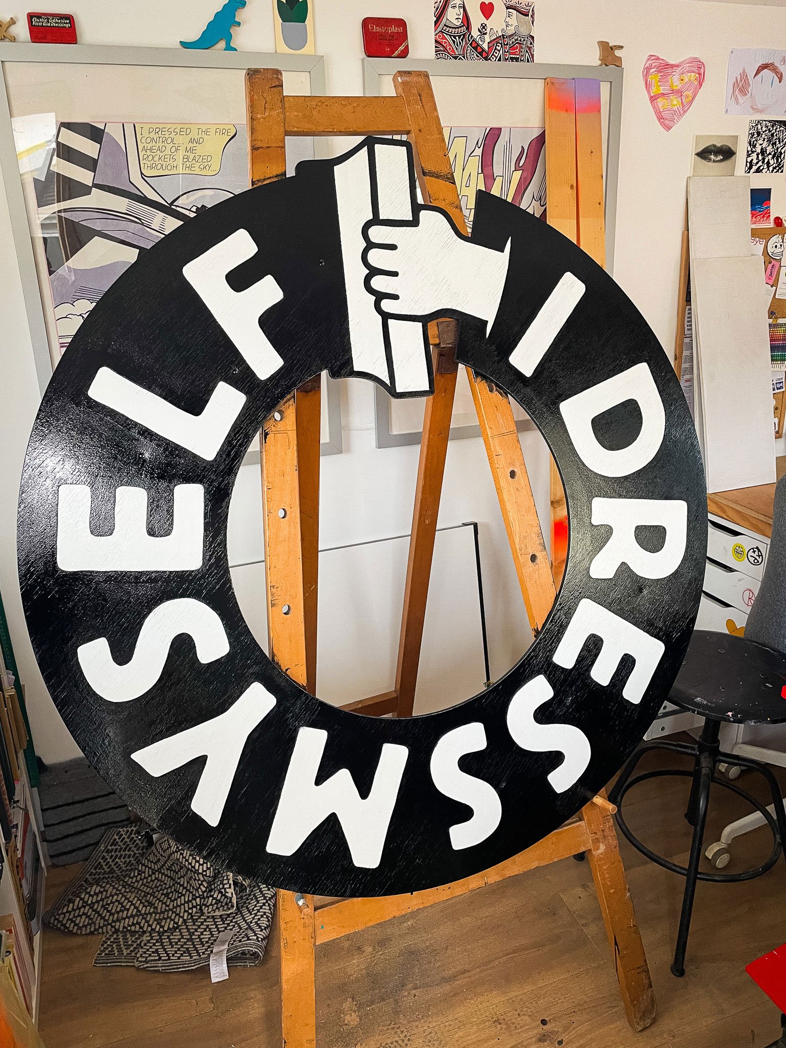 I Dress Myself, a screen printing studio in Frome, asked me to bring their logo to life on the front of their premises. Hand-painted signage design and installation by Rich C Studio, sign painting and graphic design studio, Frome.