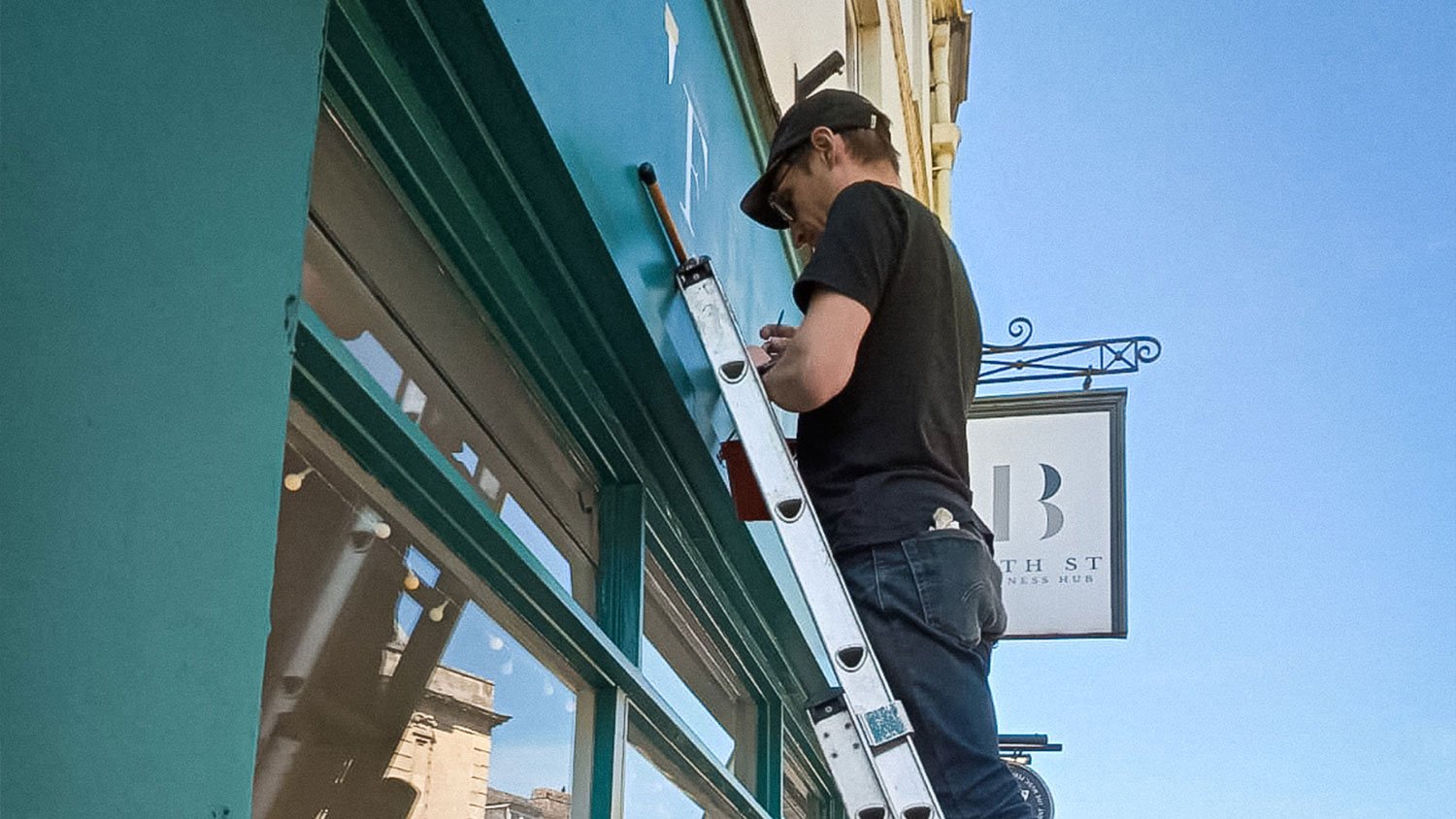 Firefly Property, Bath Street, Frome. Hand-painted shopfront by Rich C Studio, sign painting and graphic design studio, Frome.