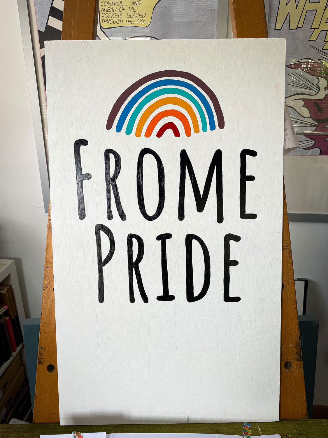 Hand-painted signage commissioned by Frome Pride 2024. This piece was used as an interactive display piece which encouraged attendees to add their own finger prints to the painted sign. The final sign featured bold, custom lettering, vibrant colours 