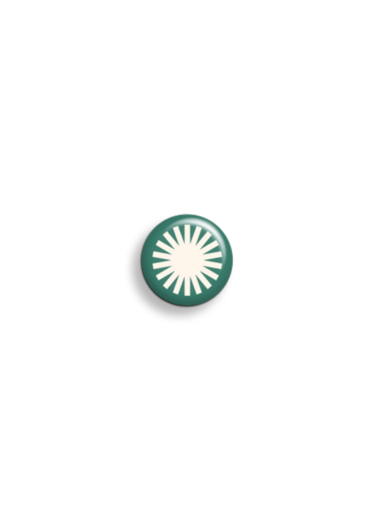 Burst Icon Badge. Bold and eye-catching, this badge is perfect for those who love a pop of energy in their style. 25mm circular badge.