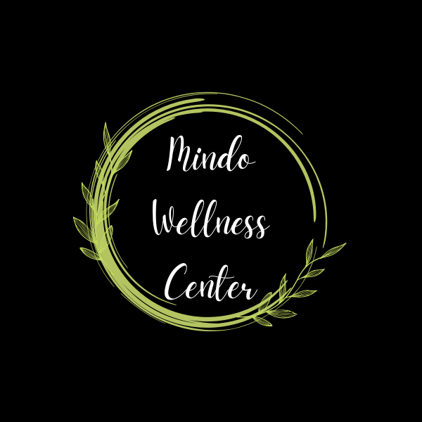 Logo for Mindo Wellness Center with a green circular leafy design on a black background.
