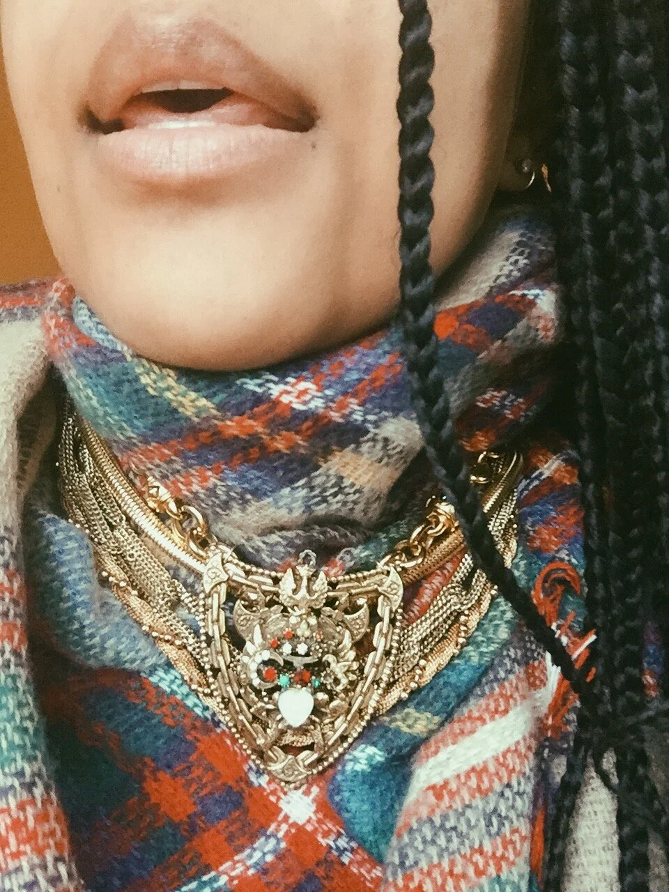 PROJEKT #31 - ZUERST Collection - $462 --- a gold 4-layer piece, is adorned by a large brooch. This PROJEKT has more weight (for those who like “meatier” pieces), and easily styles on top of a scarf. Antique crest brooch contains: pearls; red, clear,