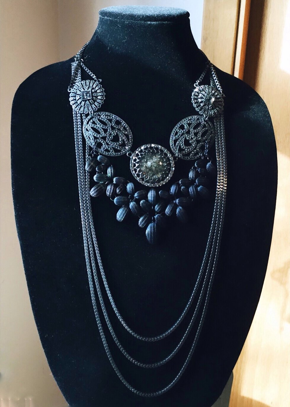 PROJEKT #45 - ZUERST Collection - ON RENTAL - also known as “Obsidian Dream”, #45 is a long-line gunmetal-tone statement piece. The top layer has 5 detailed circular elements, the middle layer presenting as a petaled pattern, and the lowest layer bei