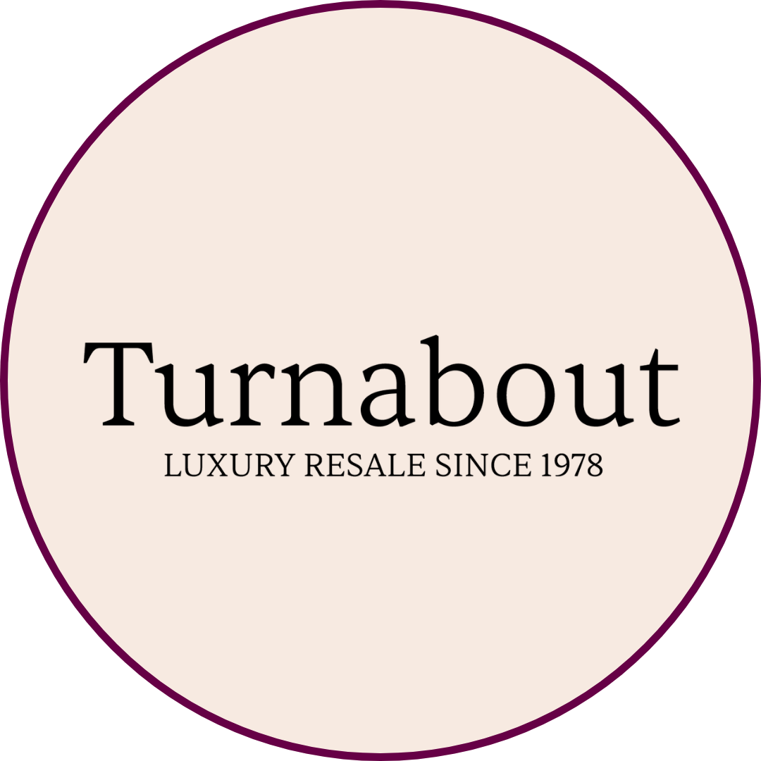 Turnabout logo on a tan background.