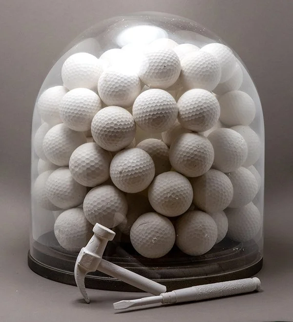 Golf Balls, plaster and glass on wood base, 10x10, 2025