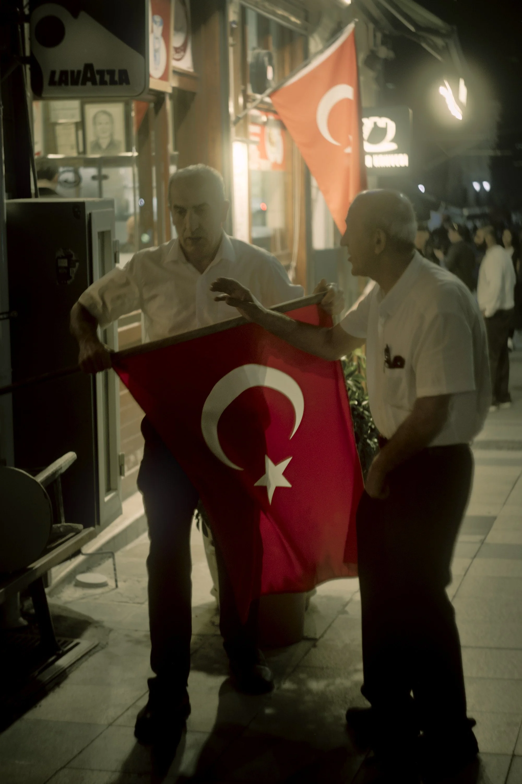 Bringing the flag in for the night in Istanbul.