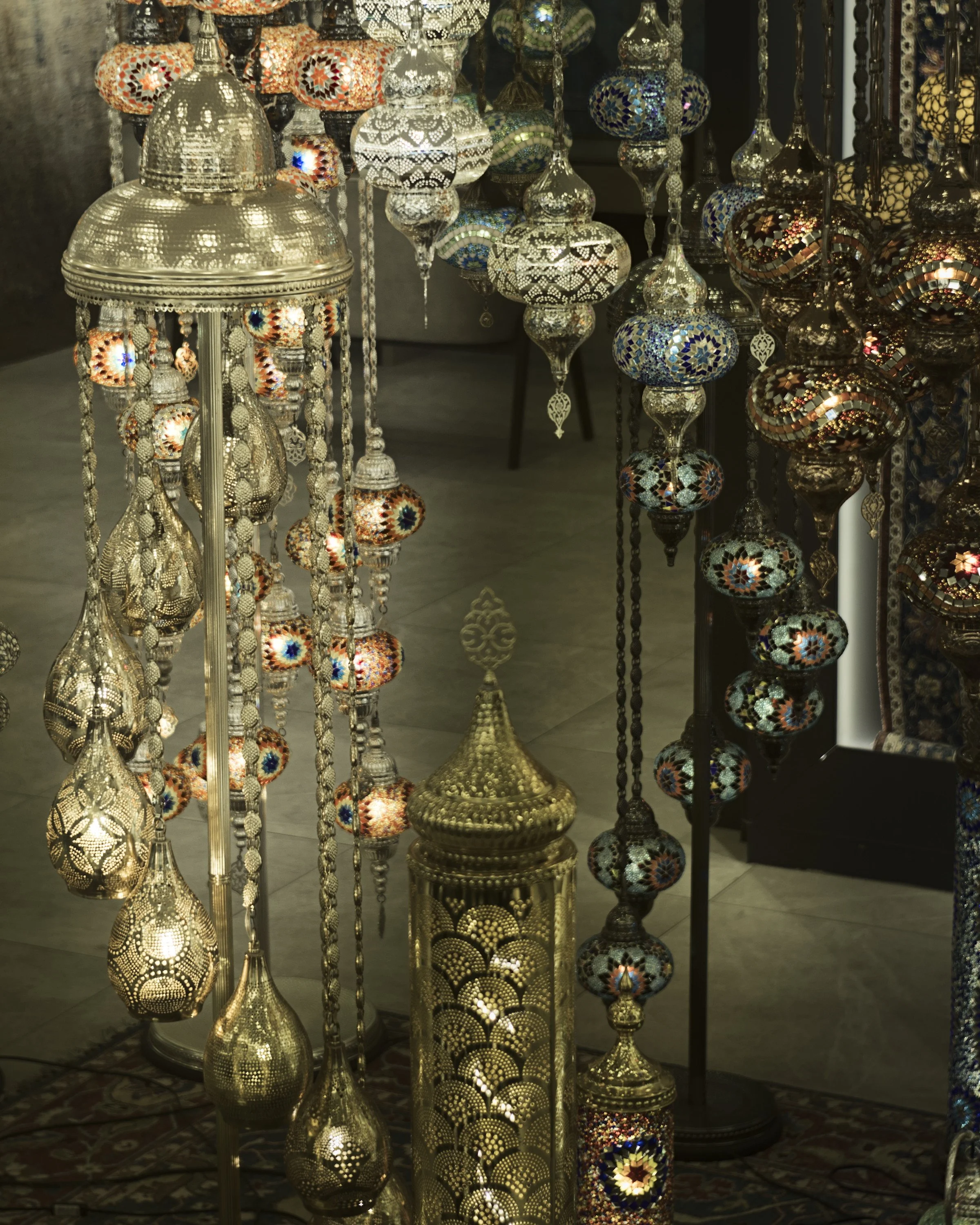 Colorful lamps in a shop window.