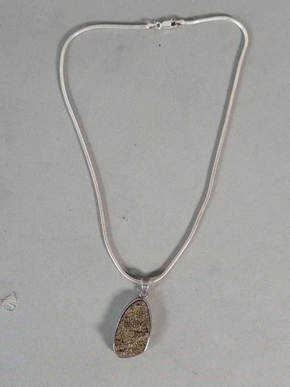 122 - Lot 612 - Sterling silver necklace with a pyrite druzy.jpg