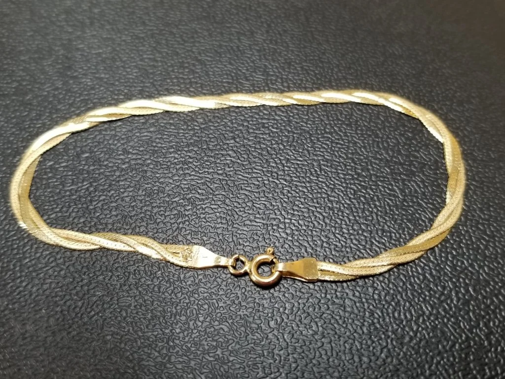 033_Lot_169_Italian_14k_gold_braided_bracelet.jpg