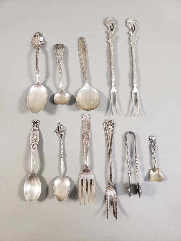 087_Lot_4_Sterling_silver_souvenir_spoons,_fork,_and_tongs.jpg