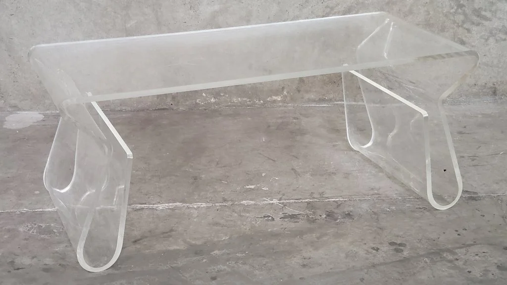 145 Umbra-styke acrylic coffee table with magazine.jpg