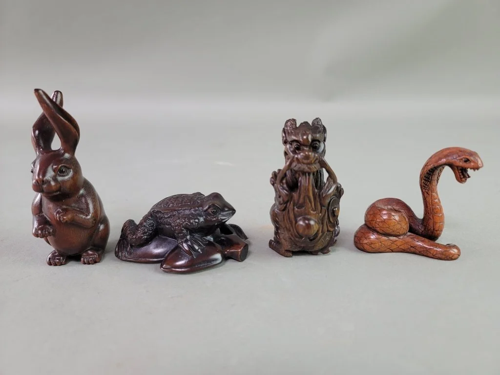064 - Lot 222 - Four Japanese carved wood netsukes.jpg