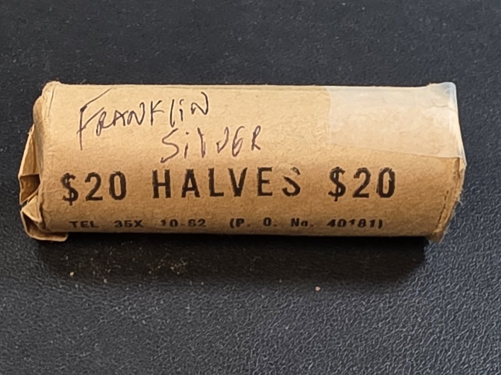 515 Roll of 40 circulated Franklin silver half dollar.jpg