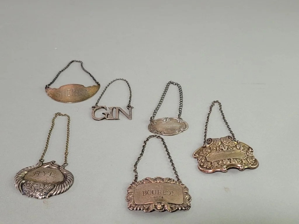 097_Rank_097_Lot_385_Six_sterling_silver_bottle_tags.jpg