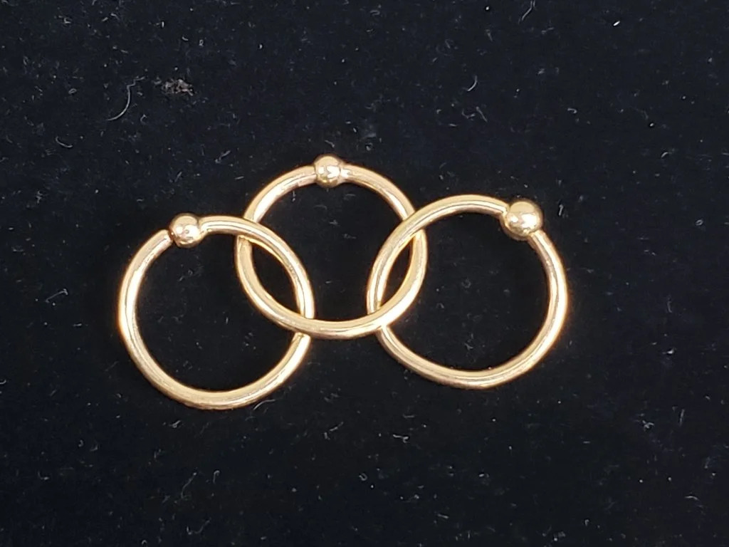 025_Rank_025_Lot_207_14k_gold_captive_bead_rings.jpg