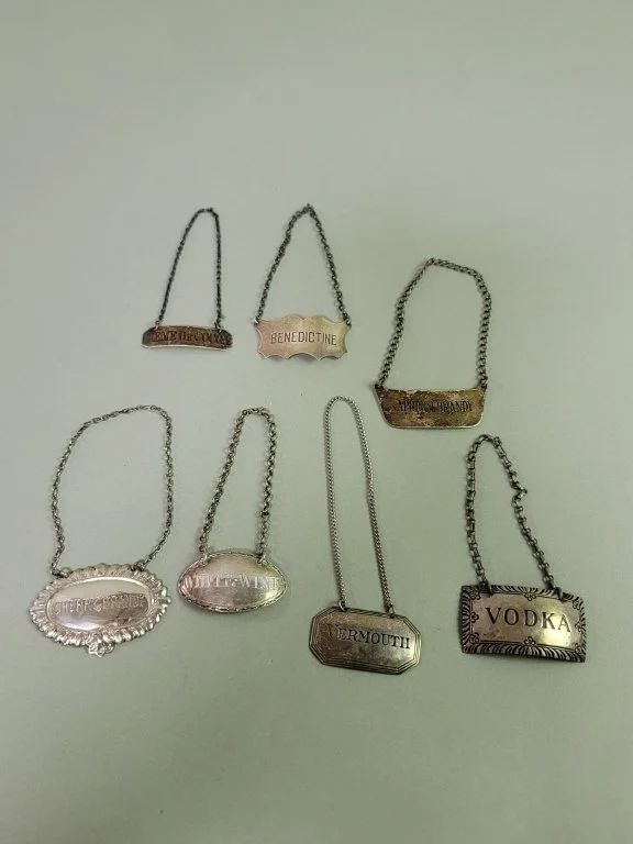 124_Rank_124_Lot_387_Seven_sterling_silver_bottle_tags.jpg