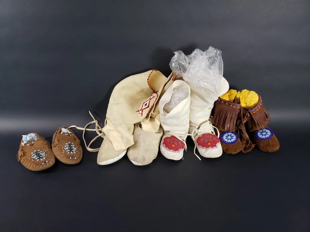 079 - 406 Group of traditional soft hide Native American.jpg