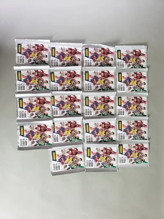 178_Lot_723_Nineteen_sealed_2018ΓÇô2019_Panini_NBA_Sticker_Collection_packs.jpg