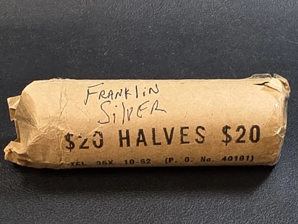 18 Roll of 40 circulated Franklin silver half dollar.jpg