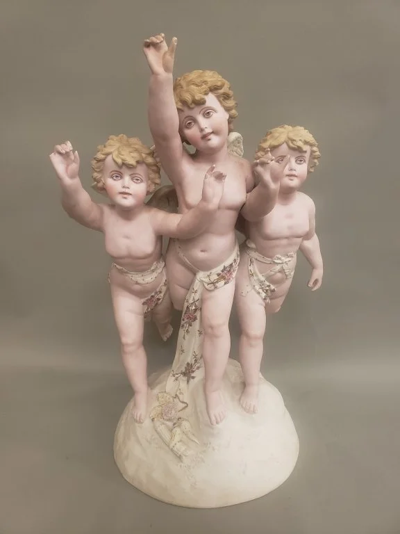 104_Lot_471_German_porcelain_cherub_sculpture.jpg