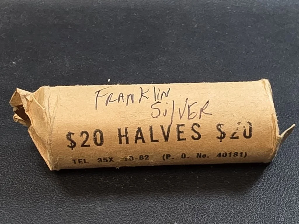 275 Roll of 40 circulated Franklin silver half dollar.jpg