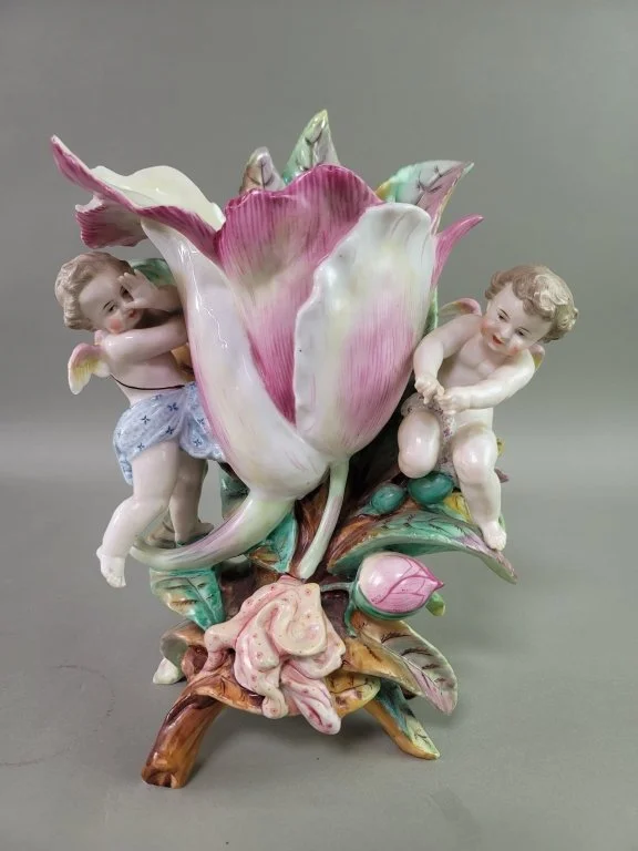 023_Lot_658_Antique_K_P_M_porcelain_cherub_and_flower.jpg