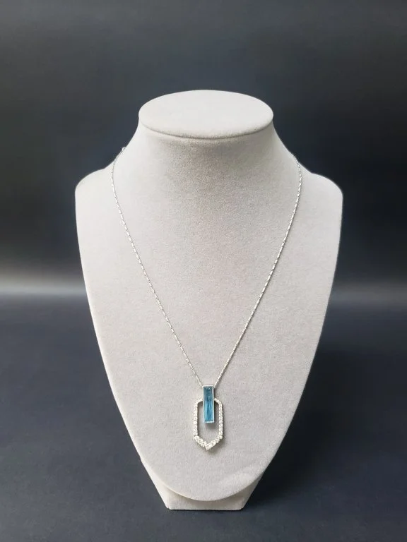 004_Lot_137_14k_white_gold_diamond_and_blue_topaz_pendant.jpg