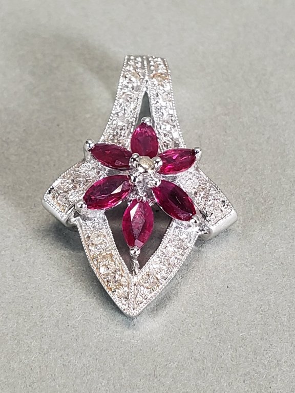 016_Lot_15_14k_white_gold,_ruby,_and_diamond_pendant.jpg
