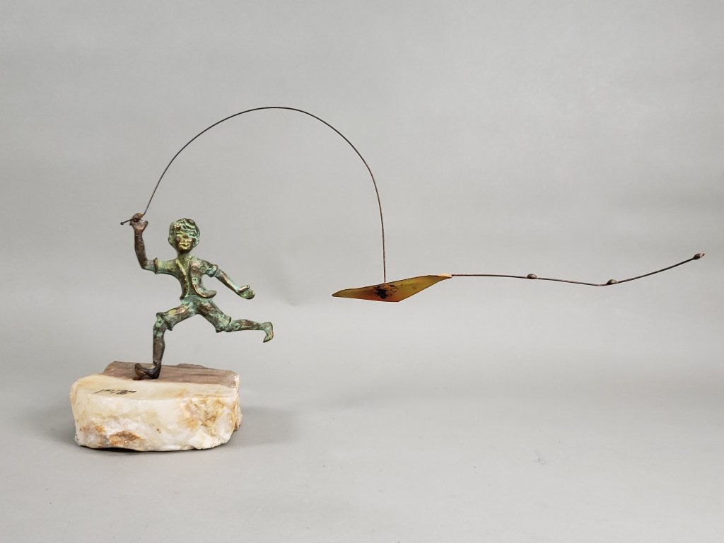 076_Lot_123_Vintage_Bijan_brass_and_onyx_Boy_Flying_a_Kite_sculpture.jpg