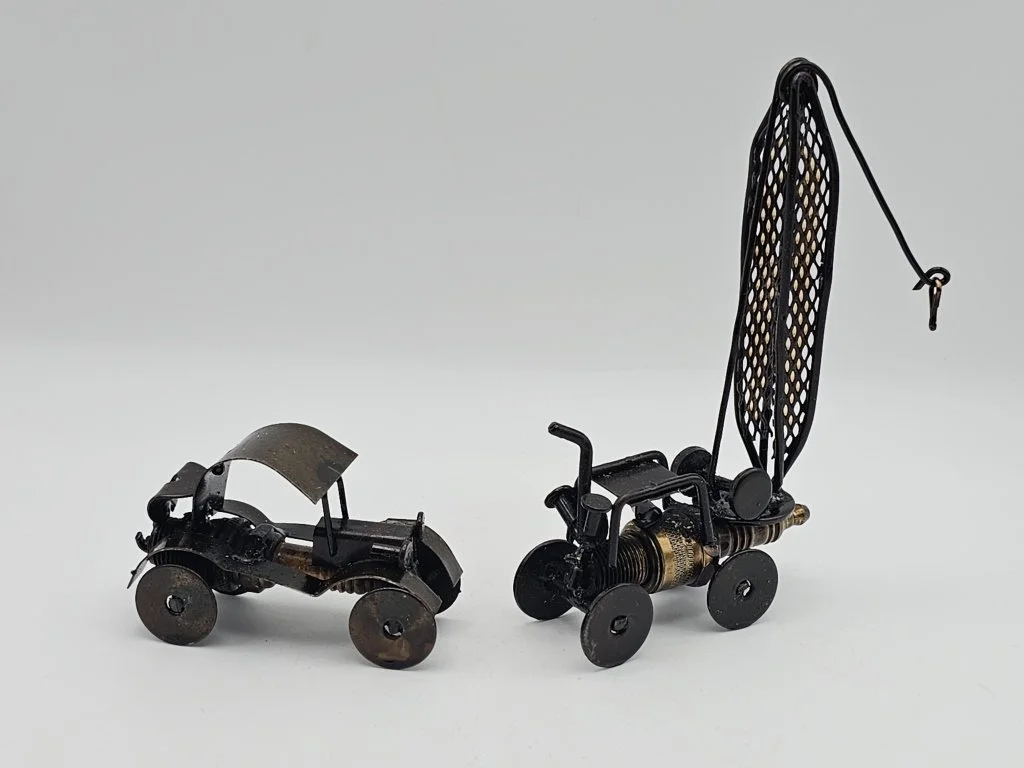 127_Lot_384h_Pair_of_handcrafted_scrap_metal_and_car.jpg