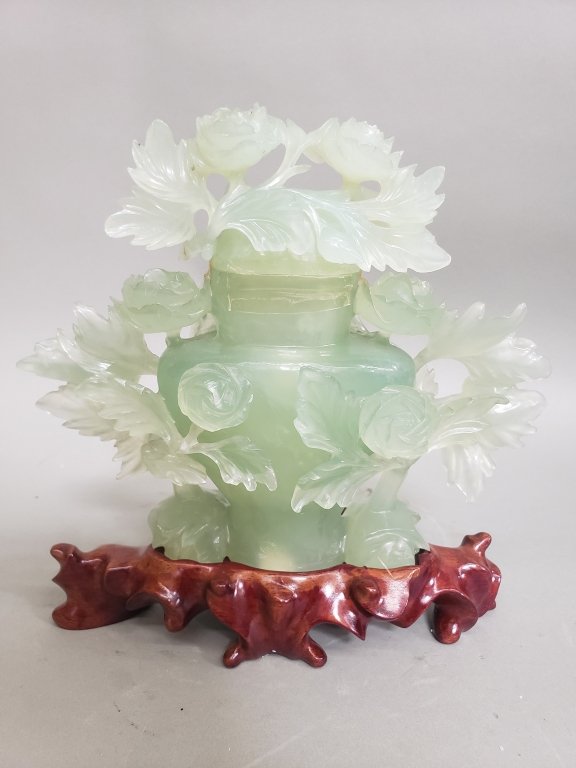 103 - 572 Carved jadeite sculpture featuring an urn and.jpg