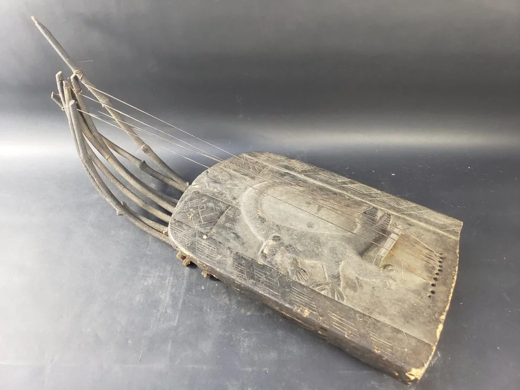 142 - Lot 174 - Vintage African carved wood stringed instrument.jpg