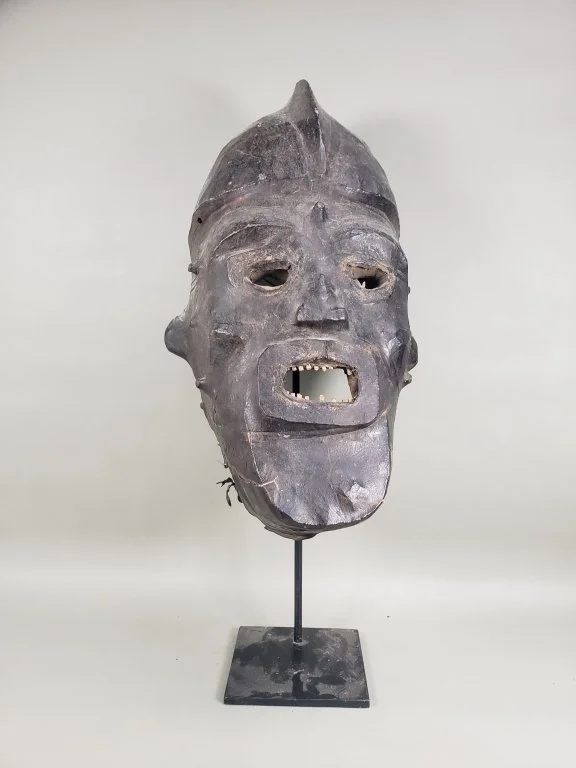 121 - Lot 50 - Vibtage African wood and leather bound helmet mask.jpg