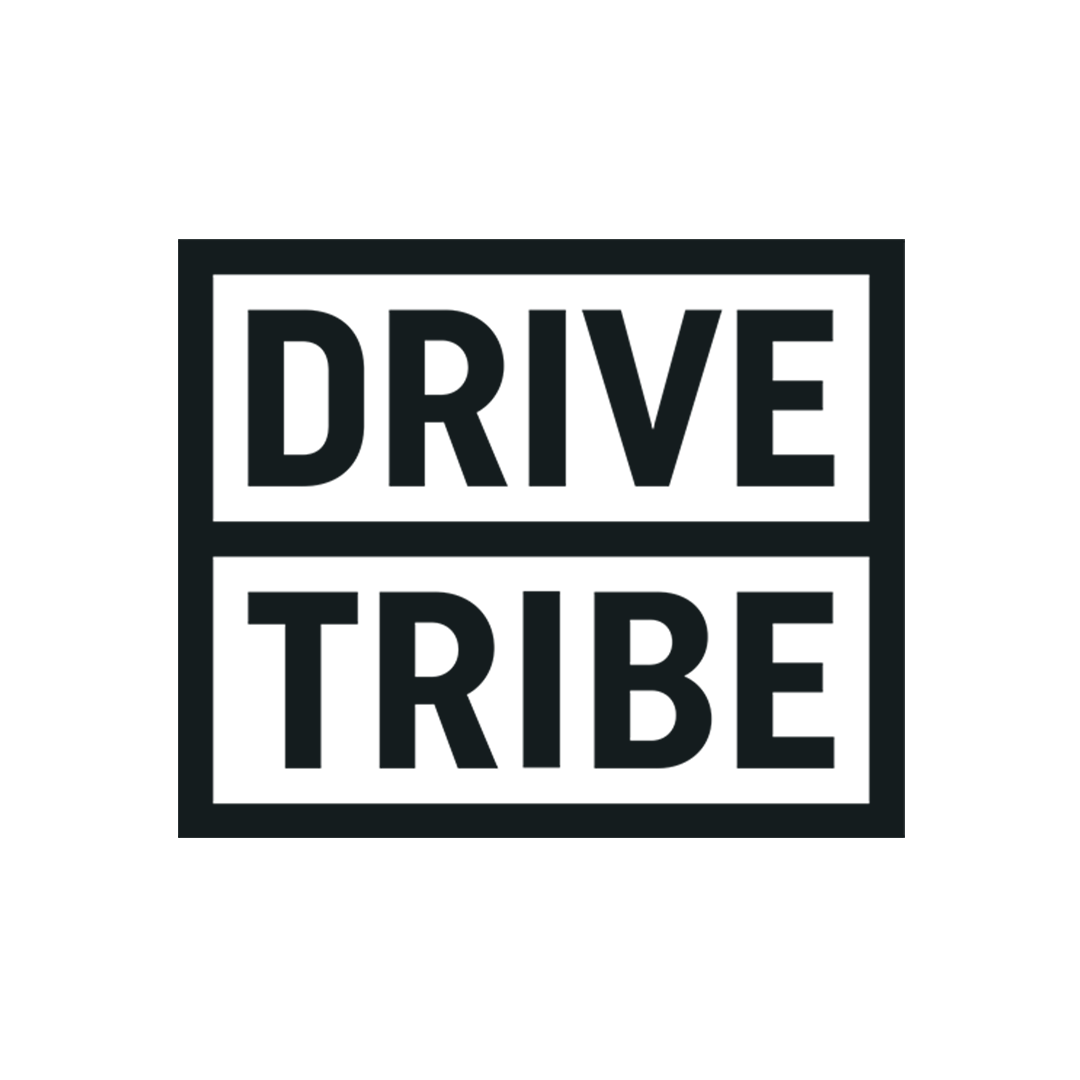 Black background with the text 'DRIVE TRIBE' written in large capital letters, divided into two sections.