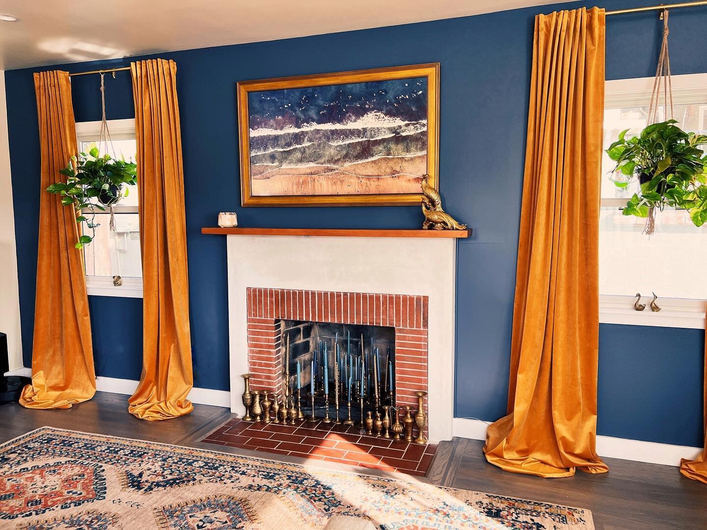 My home finally feels like a home again! Moving from Kentucky to California has been quite a journey. Behold my living room. The velvet drapes I brought from my Kentucky house, the TV is a @samsungus Frame TV and the frame around it is made by @decot