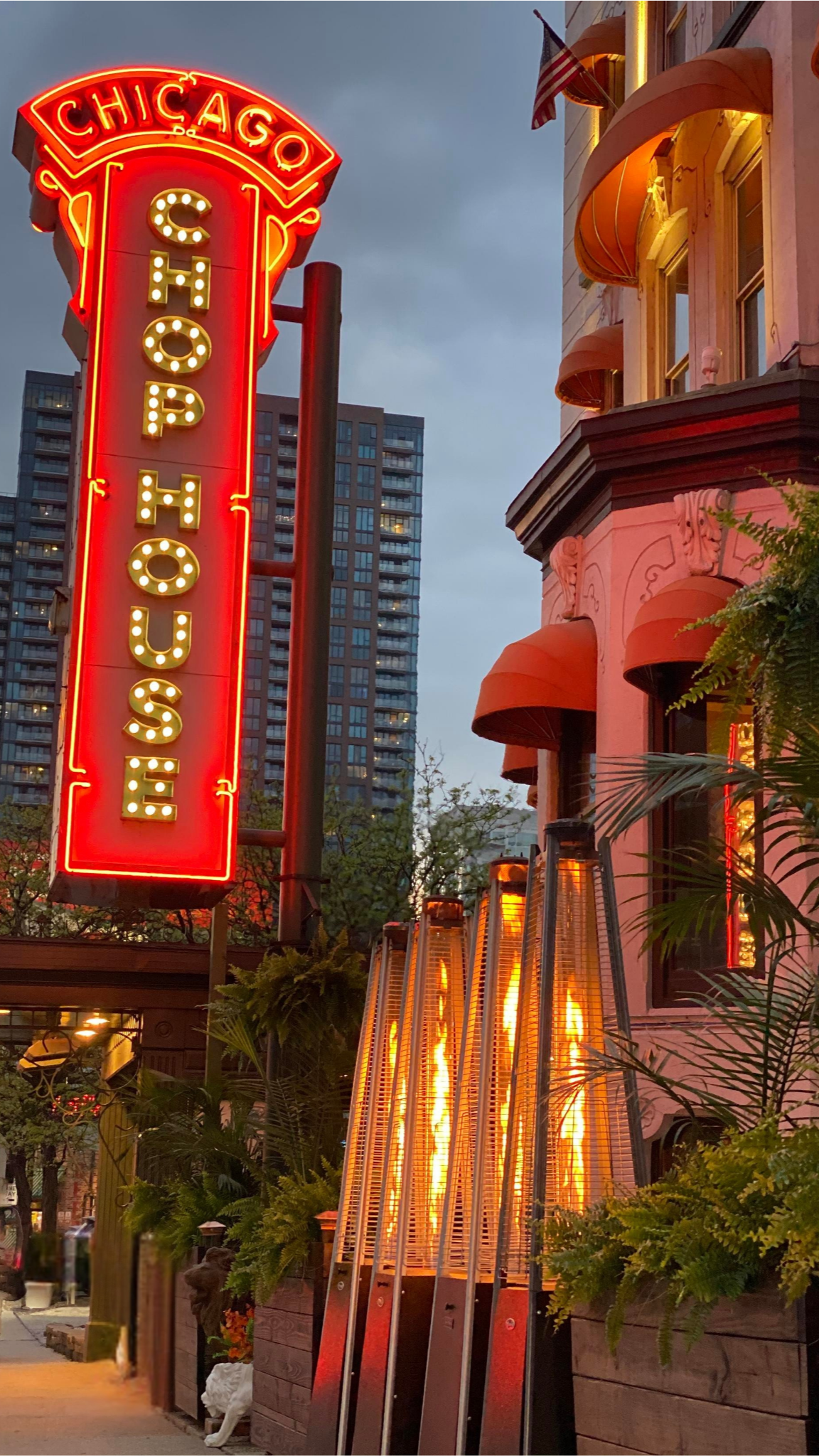 Picture of Chicago Chop House building at golden hour showcasing the neon sign