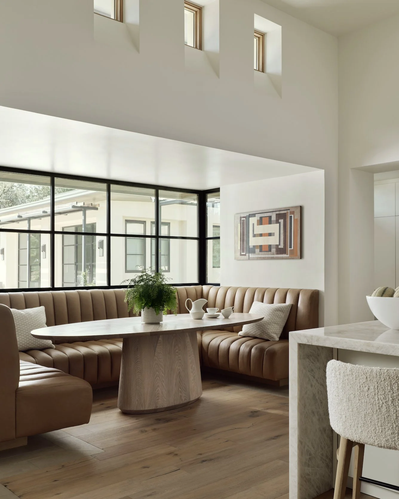 This kitchen booth is the true hub of our clients&rsquo; home&mdash;where daily life unfolds.

A heavy remodel transformed a once dark, navy banquette into a lighter, more inviting space that fits how they actually live. With no formal dining room, t